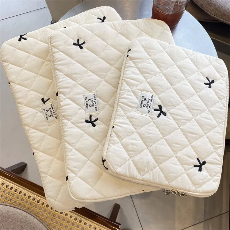 Rhombus embroidered bow design on nylon laptop storage bag showing colour and size options