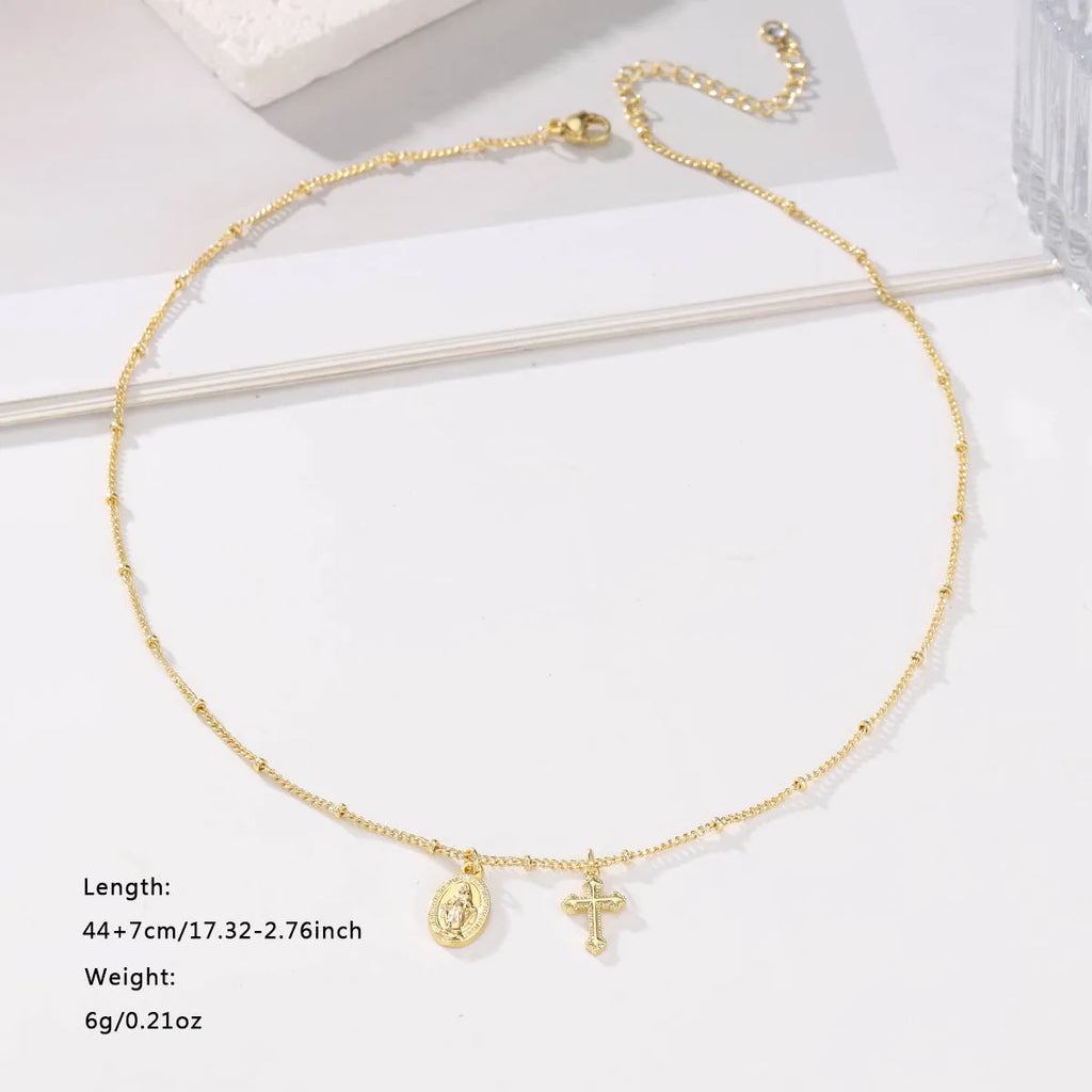 Gold cross Virgin Mary pendant necklace with geometric design on adjustable chain for women