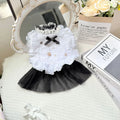 White yarn princess-style Waltz gauze skirt costume on a small dog, showing tiered design.