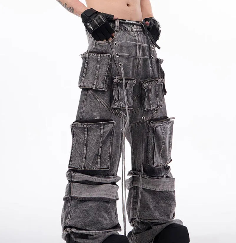 Grey distressed denim men's overalls with rope stitching and mop pant leg style