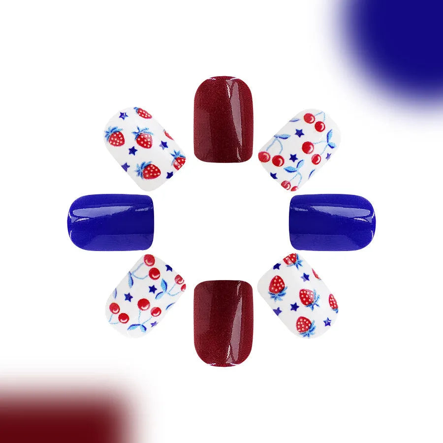 Short glossy red and blue nail stickers with strawberry and cherry pattern, pack of 24.