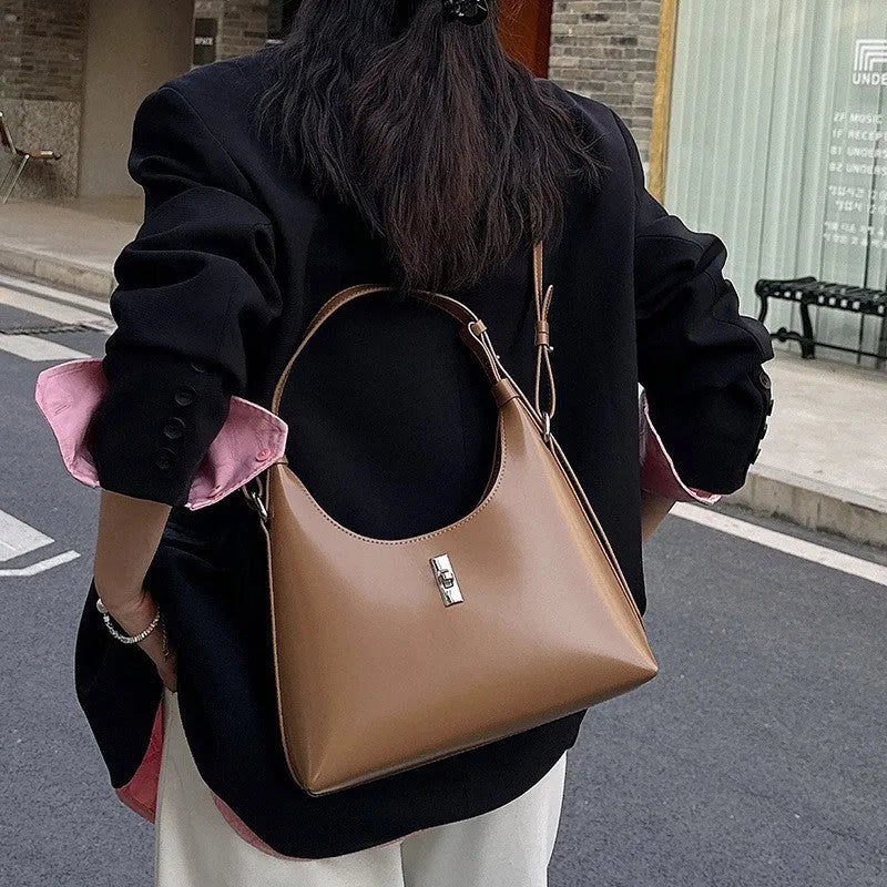 Genuine leather crossbody shoulder bag in dumpling shape with sandwich pocket design