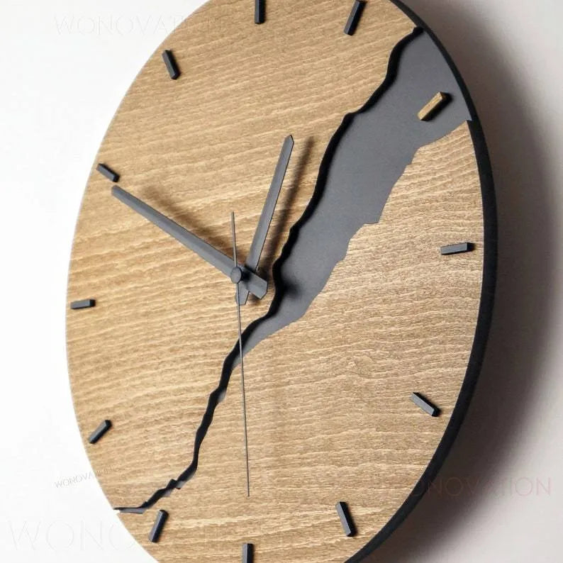 Modern round wooden wall clock with a cracked finish, 30cm in diameter.
