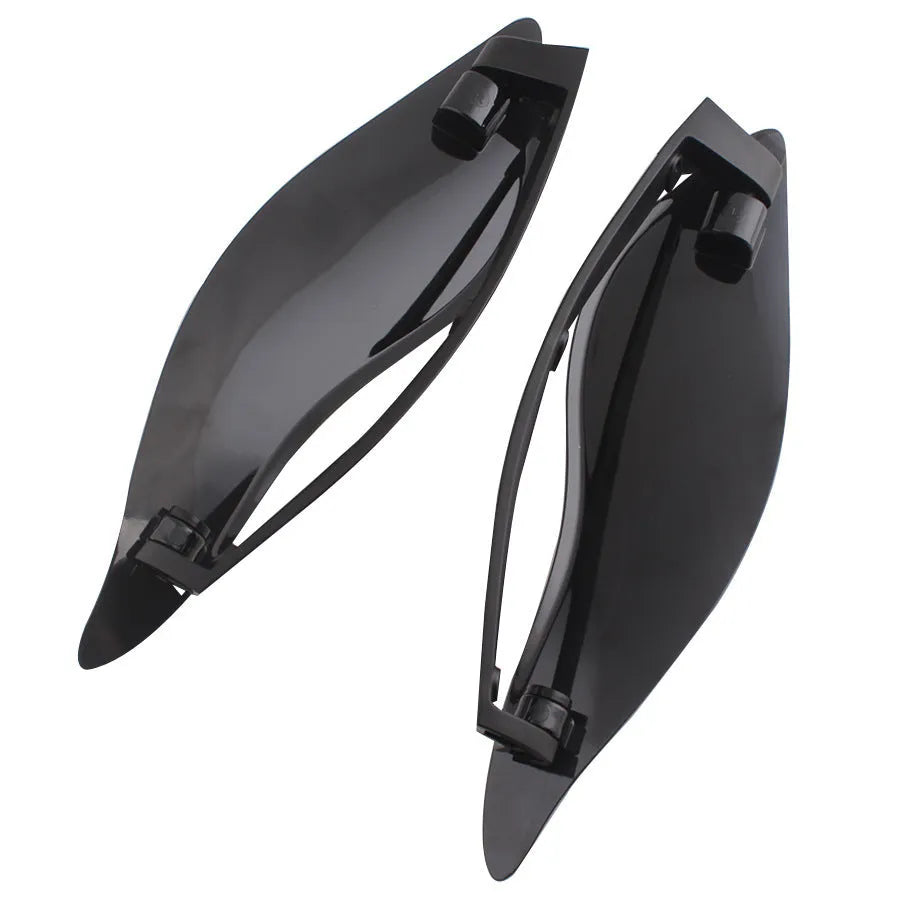 Pair of smoked ABS plastic motorcycle side wing panels for Harley trike models.