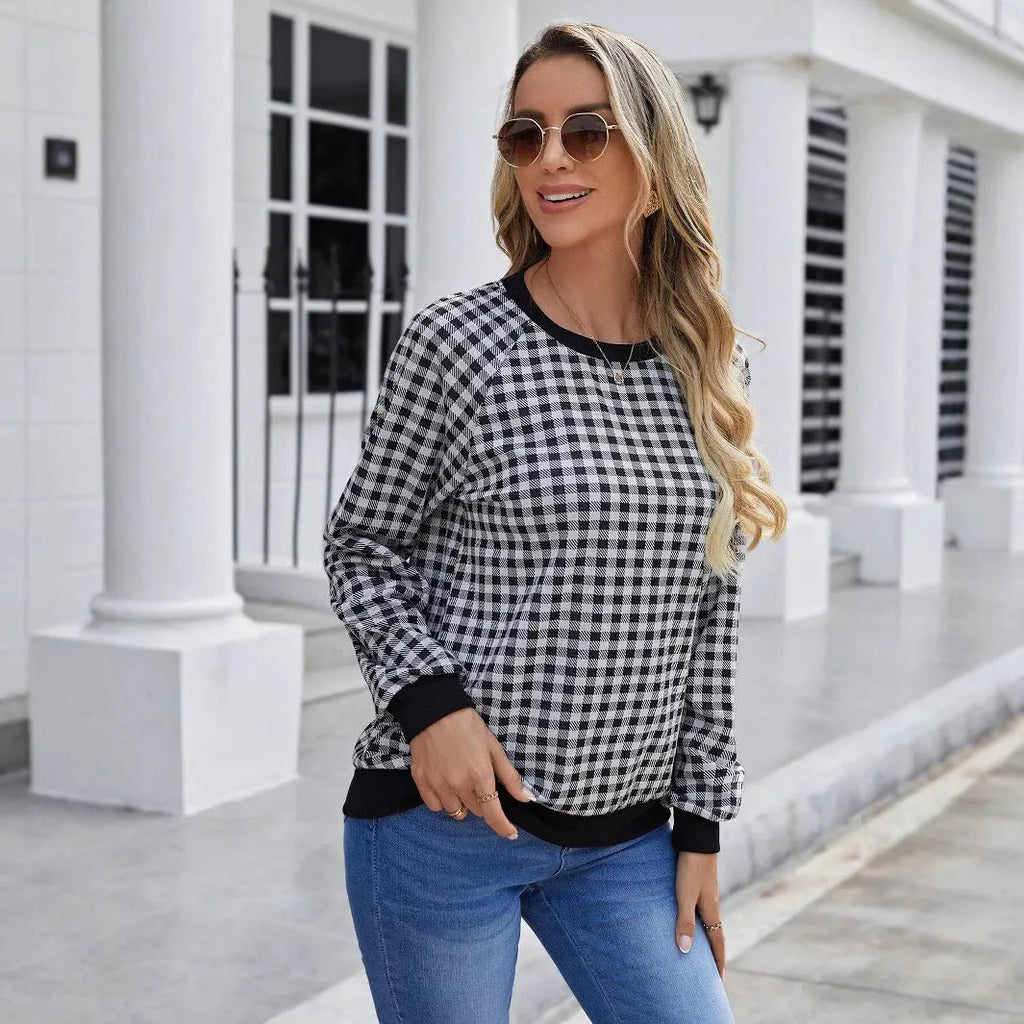 Black plaid striped long sleeve pullover sweater with printed design elements