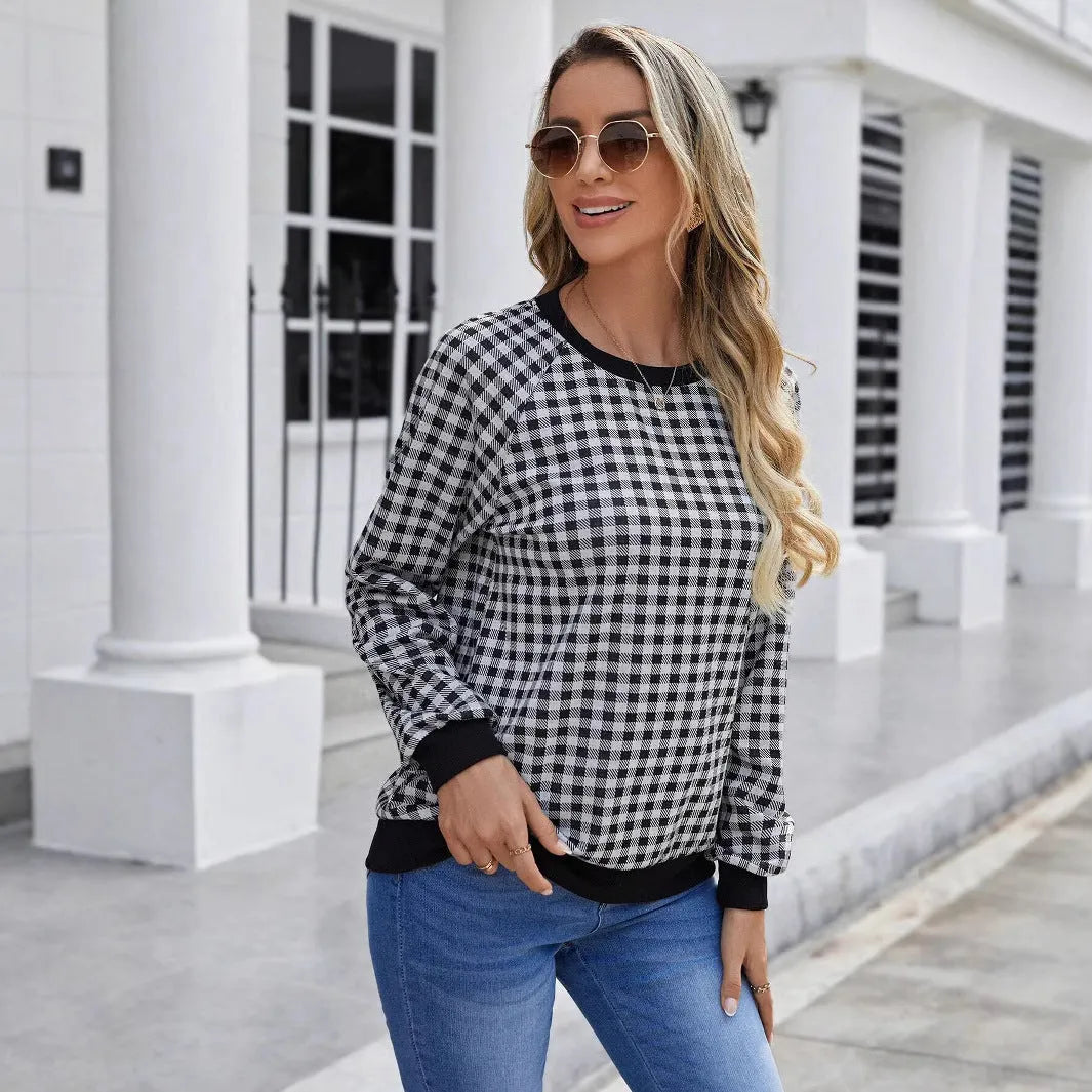 Black plaid striped long sleeve pullover sweater with printed design elements
