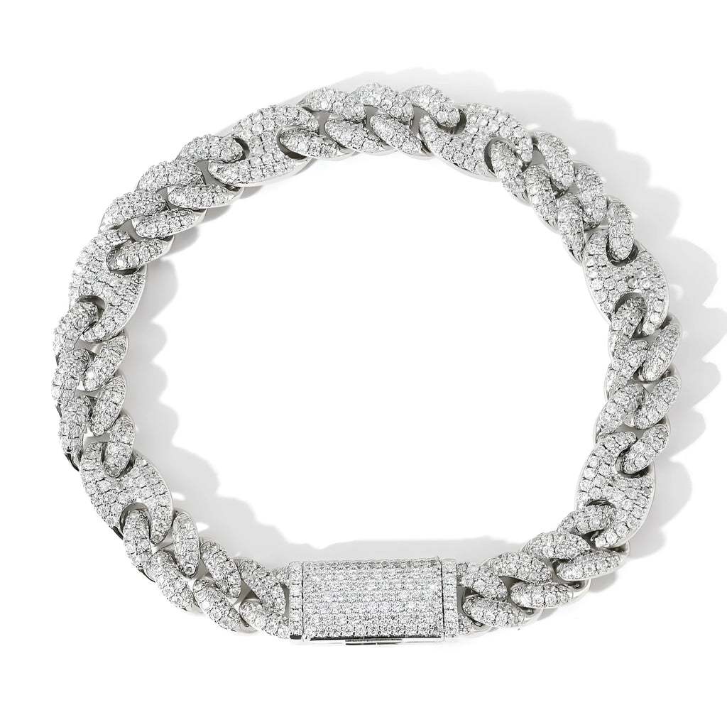 Micro inlaid zircon Cuban chain hip hop bracelet in gold and silver on a flat surface