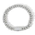 Micro inlaid zircon Cuban chain hip hop bracelet in gold and silver on a flat surface