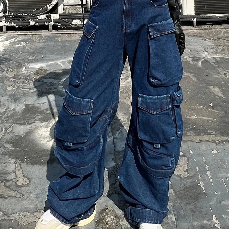 Dark blue distressed women's wide-leg jeans with a high waist and multiple pockets on a mannequin.