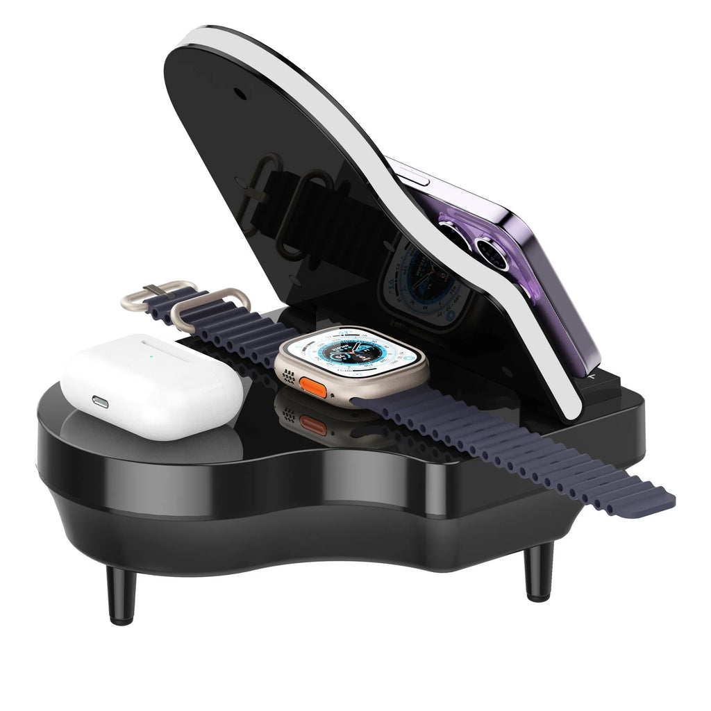 Black multi-function Bluetooth speaker with wireless charger and phone holder on a desk