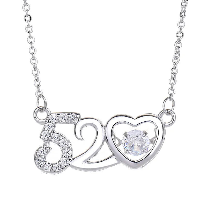 Sterling silver heart necklace with crown and bow pendant on adjustable chain
