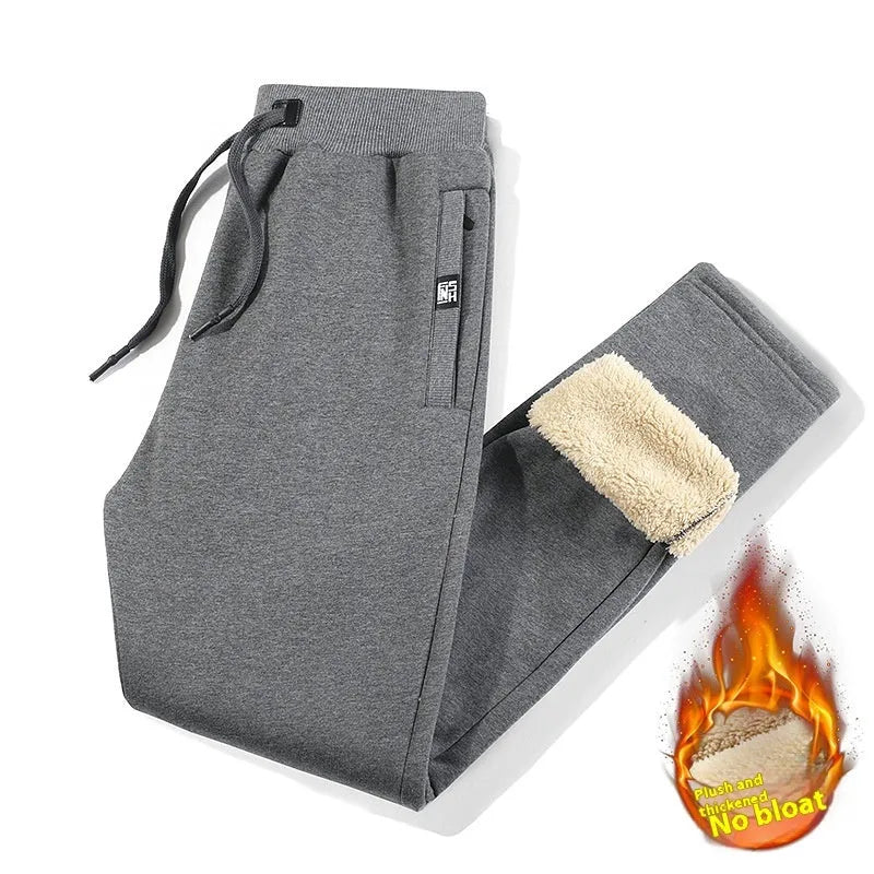 Men's gray fleece-lined oversized track pants with cotton fabric and drawstring waist