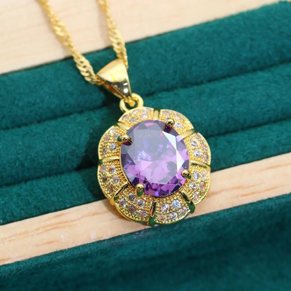 Gold plated zircon jewellery set with necklace, earrings, ring, and bracelet on display.