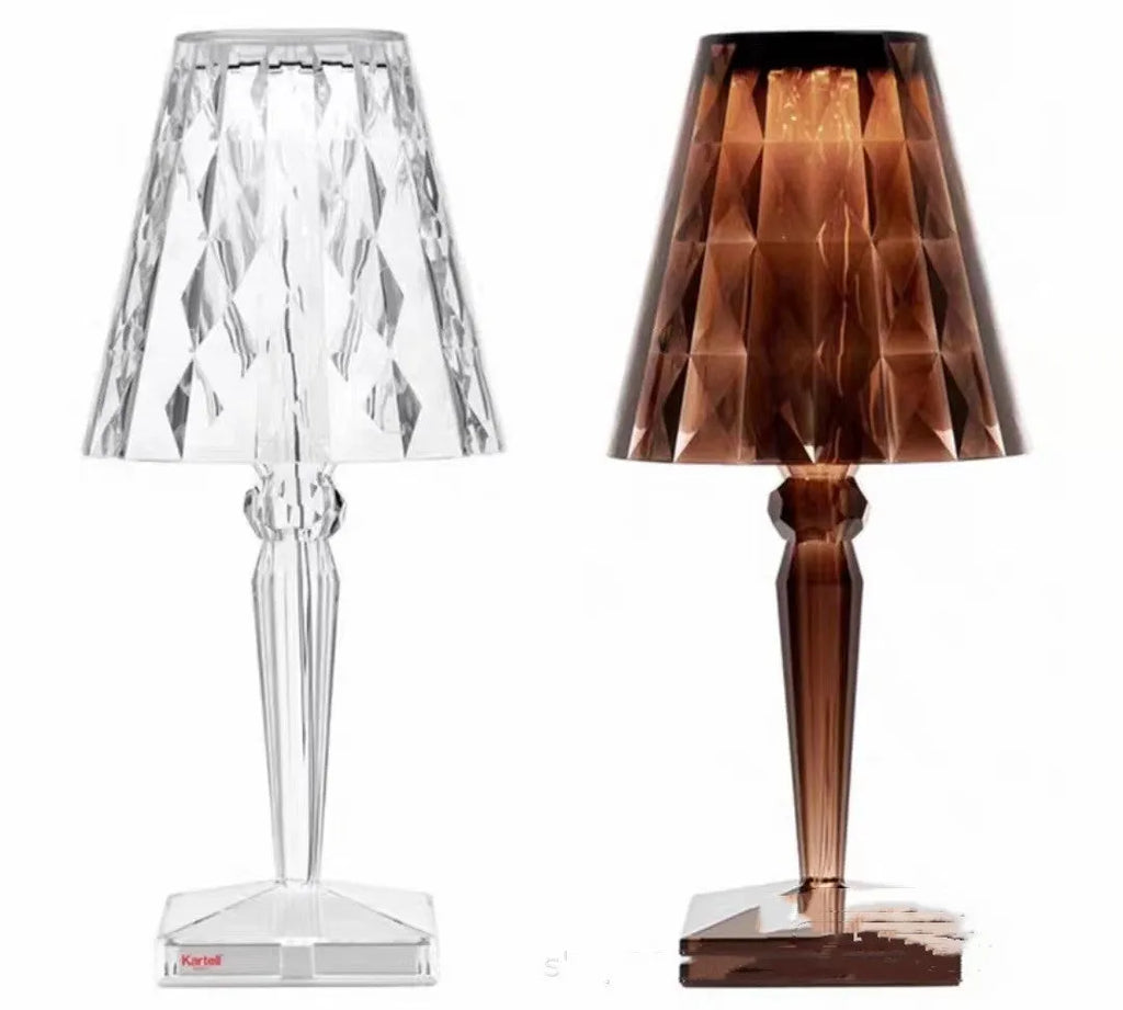 Portable rose gold touch projection night light with rechargeable battery on bedside table