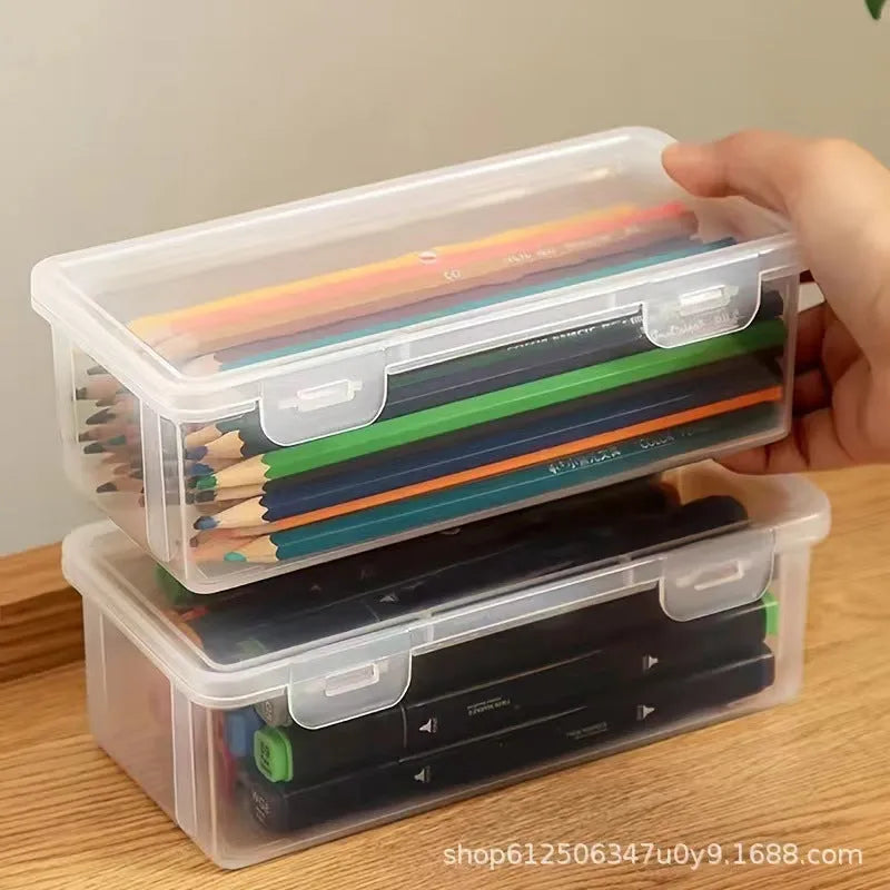 Clear plastic pencil storage box with large capacity for organising stationery and children's art supplies.