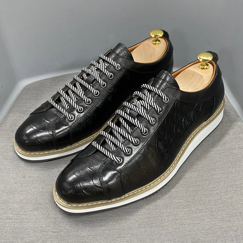 Men's black embossed pattern low-top casual shoes with lace-up front and textured upper.