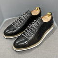 Men's black embossed pattern low-top casual shoes with lace-up front and textured upper.