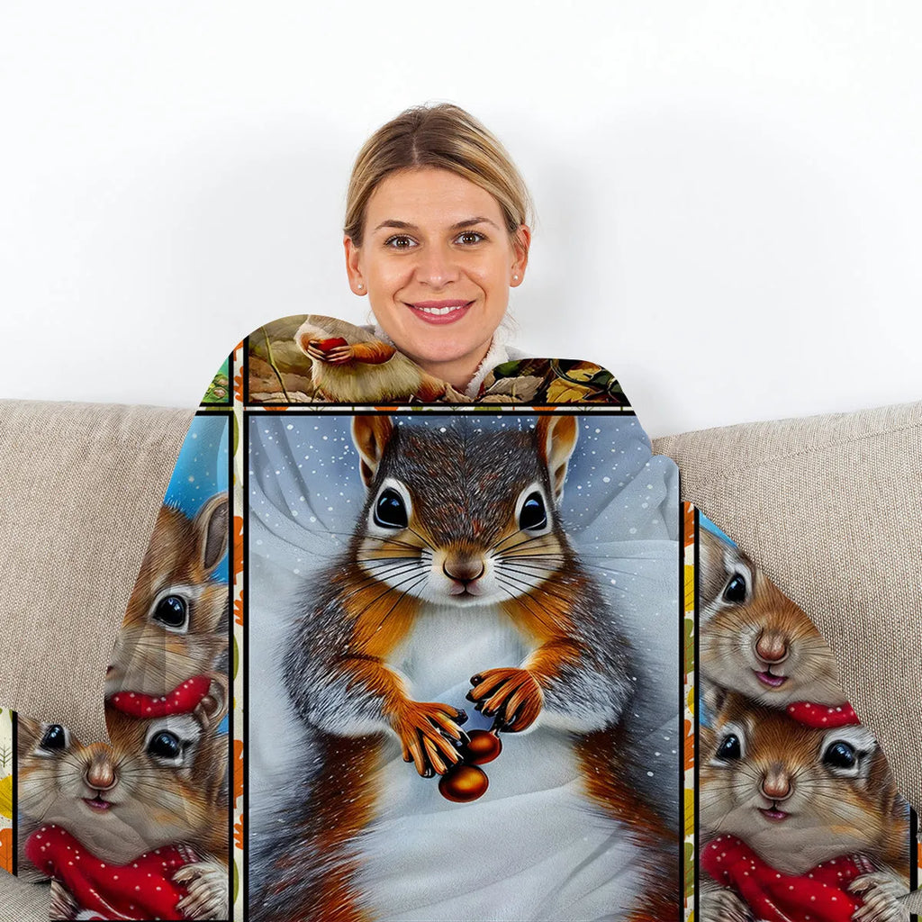 Yellow flannel blanket with white bellied squirrel print, 130x150cm, on a sofa