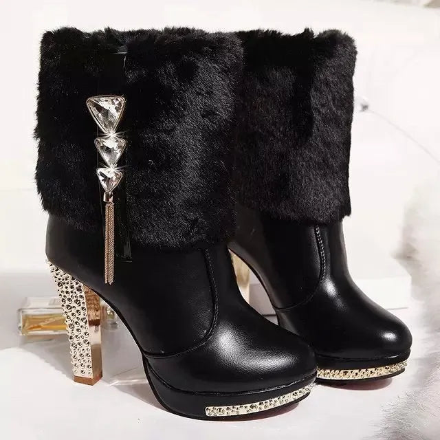 Women's black ankle boot with a chunky high heel on a white background.