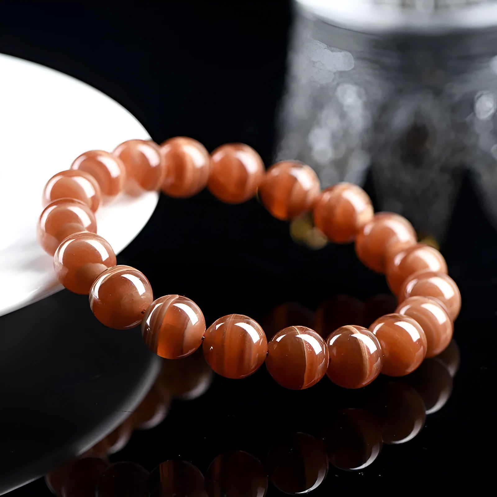 Peruvian rhodochrosite bracelet with geometric round beads in traditional ruyi design
