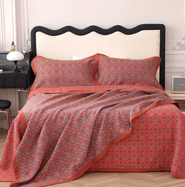 Cotton gauze three-piece blanket set with floral pattern and matching pillowcases for bed