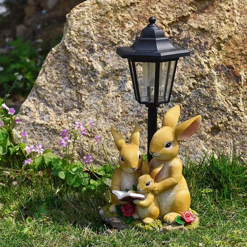 Solar powered resin garden lamp with decorative animal character design for outdoor lighting