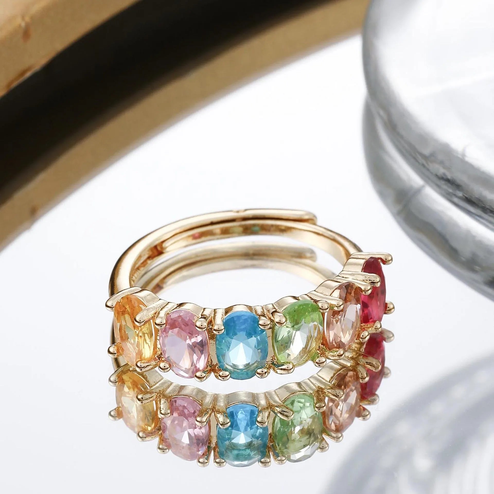 Women's gold-colour adjustable ring with zircon stones on a simple retro-style band.