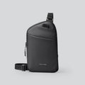 Men's black Oxford cloth crossbody bag showing reinforced sewing thread detail