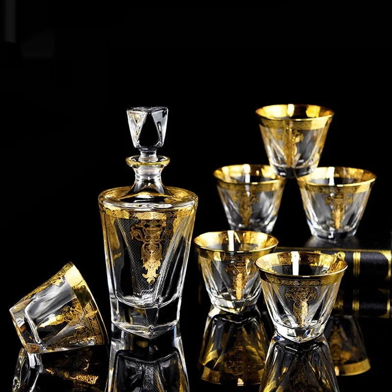 Gold line crystal glass whisky tumbler set with bottle and six glasses on white background