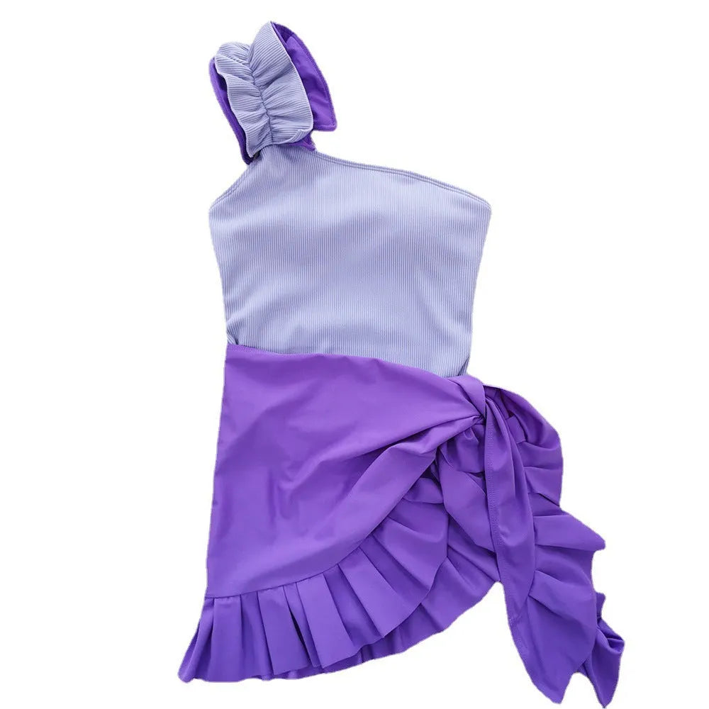 Women's single-shoulder suspender one-piece swimsuit in solid colour with high-waist design.