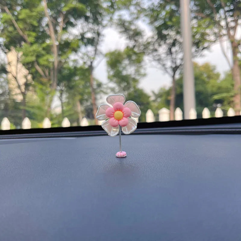 Colourful plastic swing car decoration measuring 5cm tall