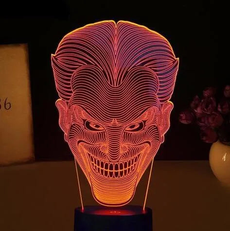 USB-powered acrylic 3D LED table lamp displaying blue light on a desk