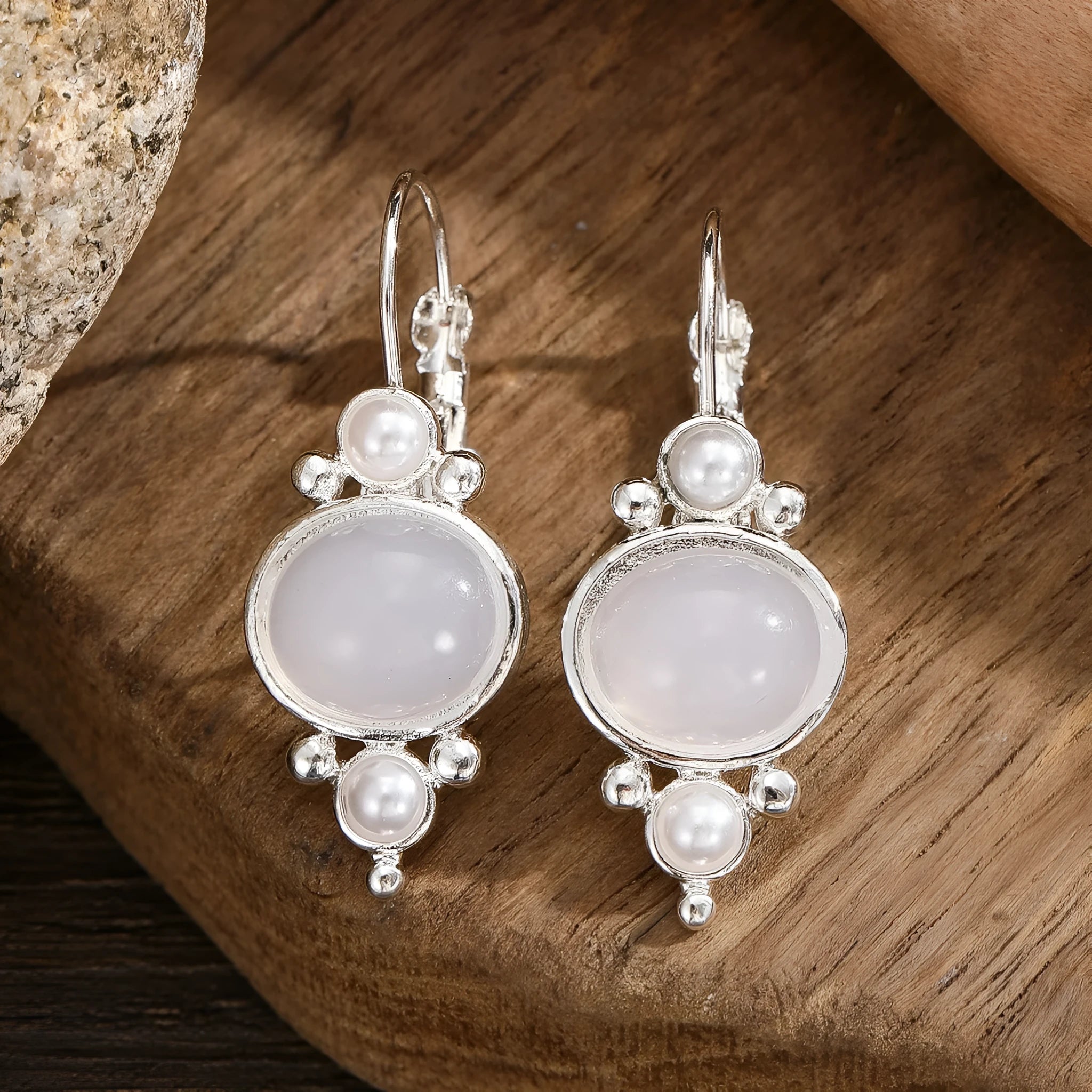 Silver round crystal eardrops with artificial pearl and geometric petal design on alloy base