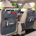 Multi-purpose auto seat organizer bag in black waterproof fabric with multiple pockets on a car seat