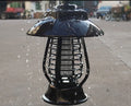 White solar-powered mosquito killer lamp with solar panel and LED lights for outdoor garden insect control