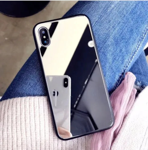 Black iPhone case with a square glass mirror on the back, compatible with iPhone 7 Plus, 8 Plus, and X models.