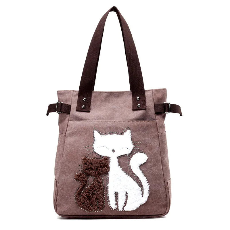 KVKY women canvas shoulder bag with cute plush cat applique in beige colour on white background