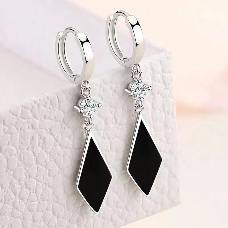 Silver geometric diamond shape drop earrings with ear clip fastenings