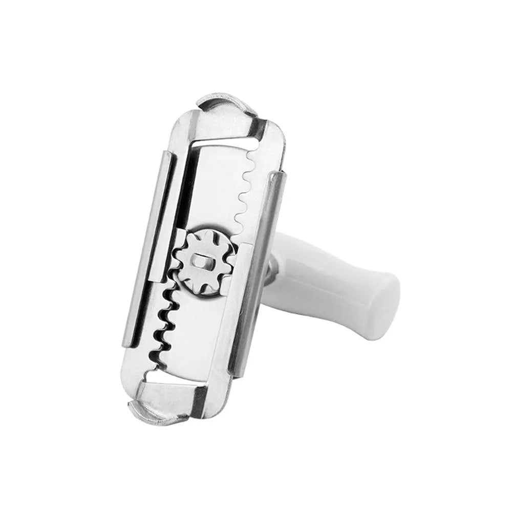 White stainless steel manual adjustable bottle opener with gear design on a table
