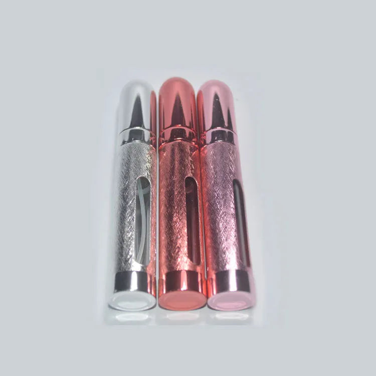 Slim 12ml aluminium and glass portable perfume bottle in multiple colours.