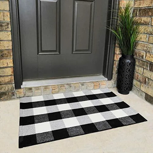 Cotton buffalo plaid rug in classic pattern on a light floor, showing non-slip backing