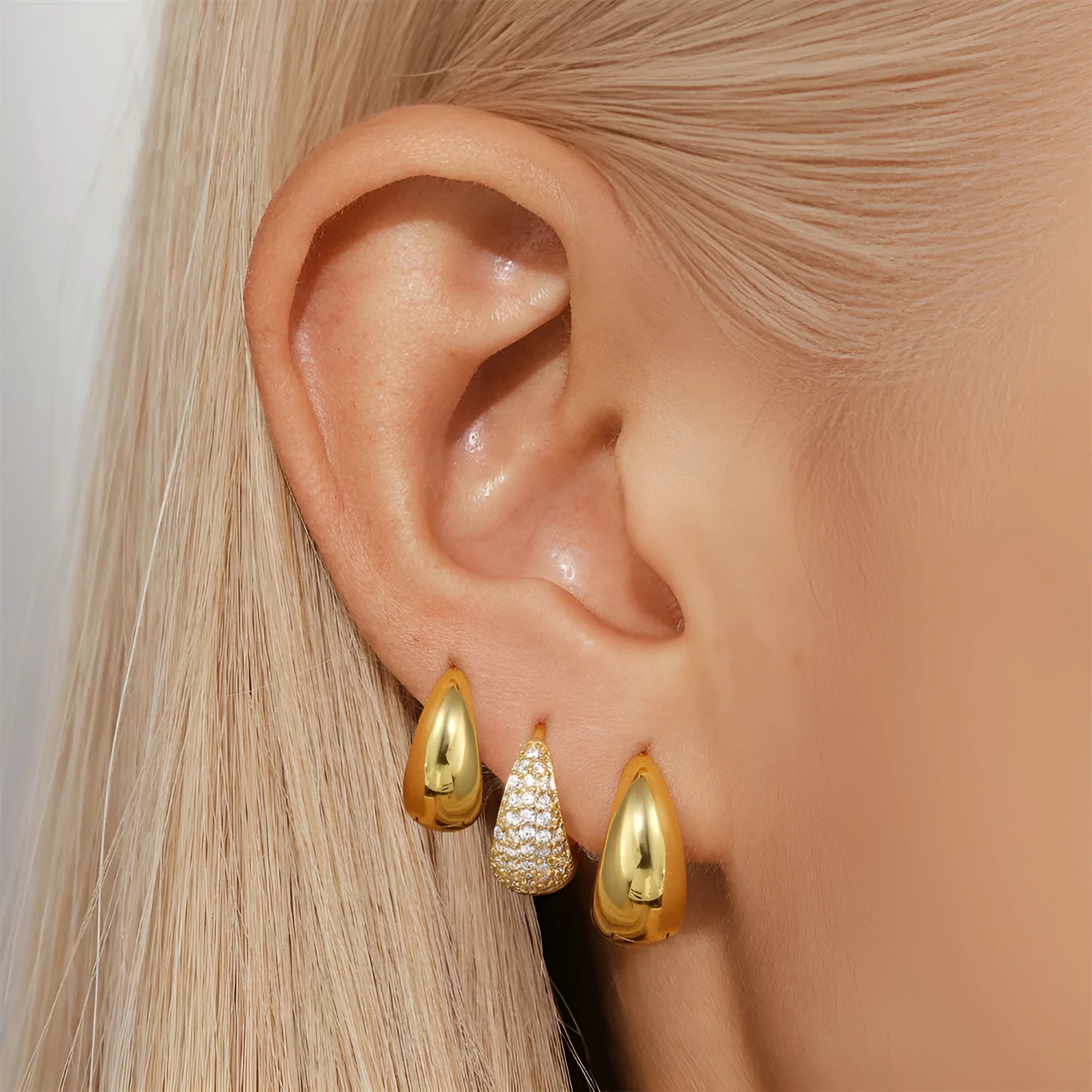 Brass geometric earclip earrings with electroplated gold finish and round design element