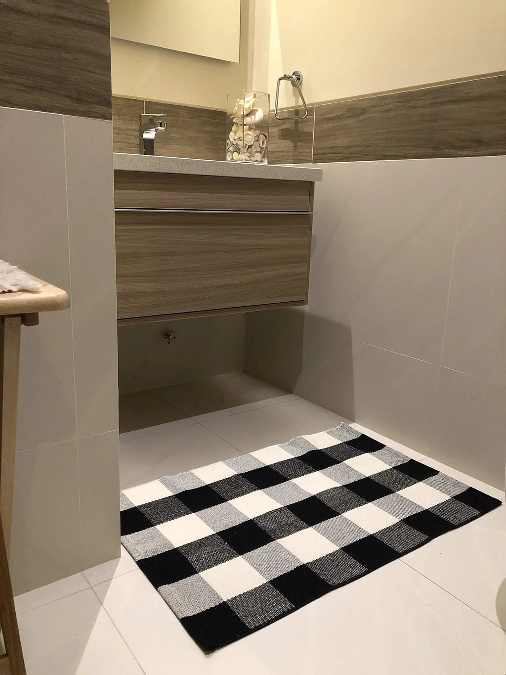 Cotton buffalo plaid rug in classic pattern on a light floor, showing non-slip backing