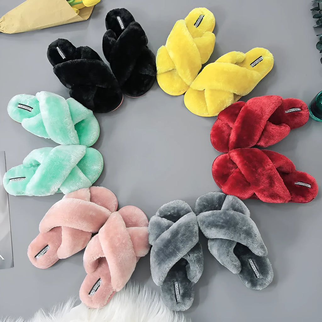 Women's black cross open-toe fur slippers showing patterned non-slip sole and soft interior