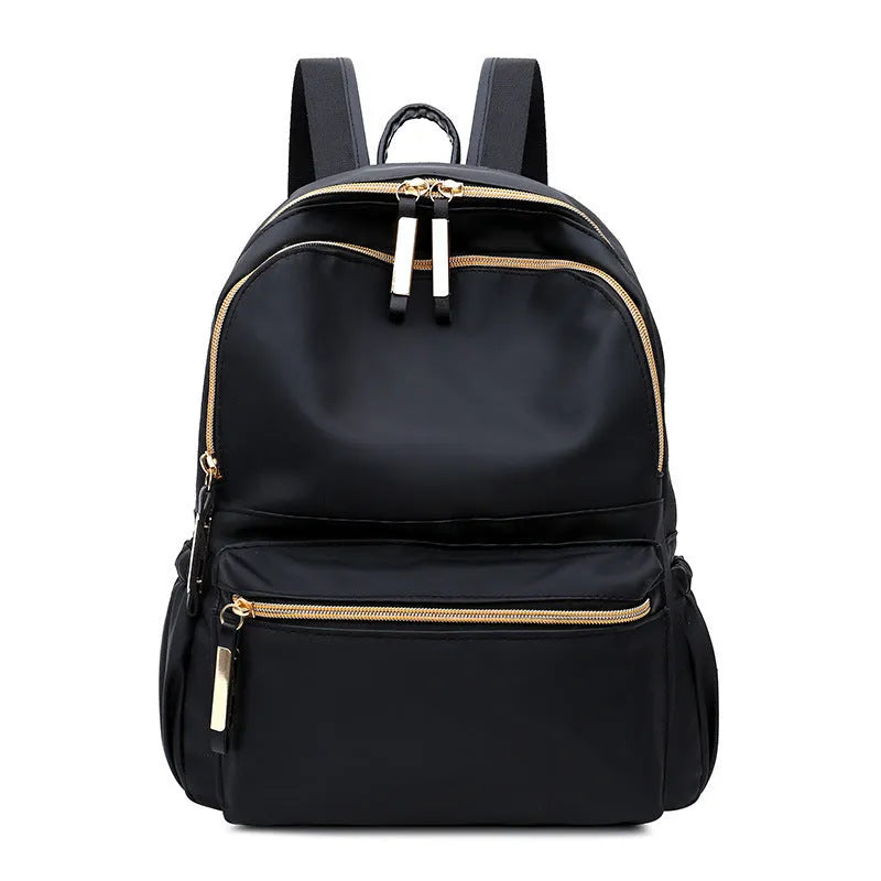 Black waterproof Oxford backpack for women, 34cm high, showing front view on plain background