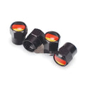 Set of four black metal aluminium alloy valve caps with German flag design on white background