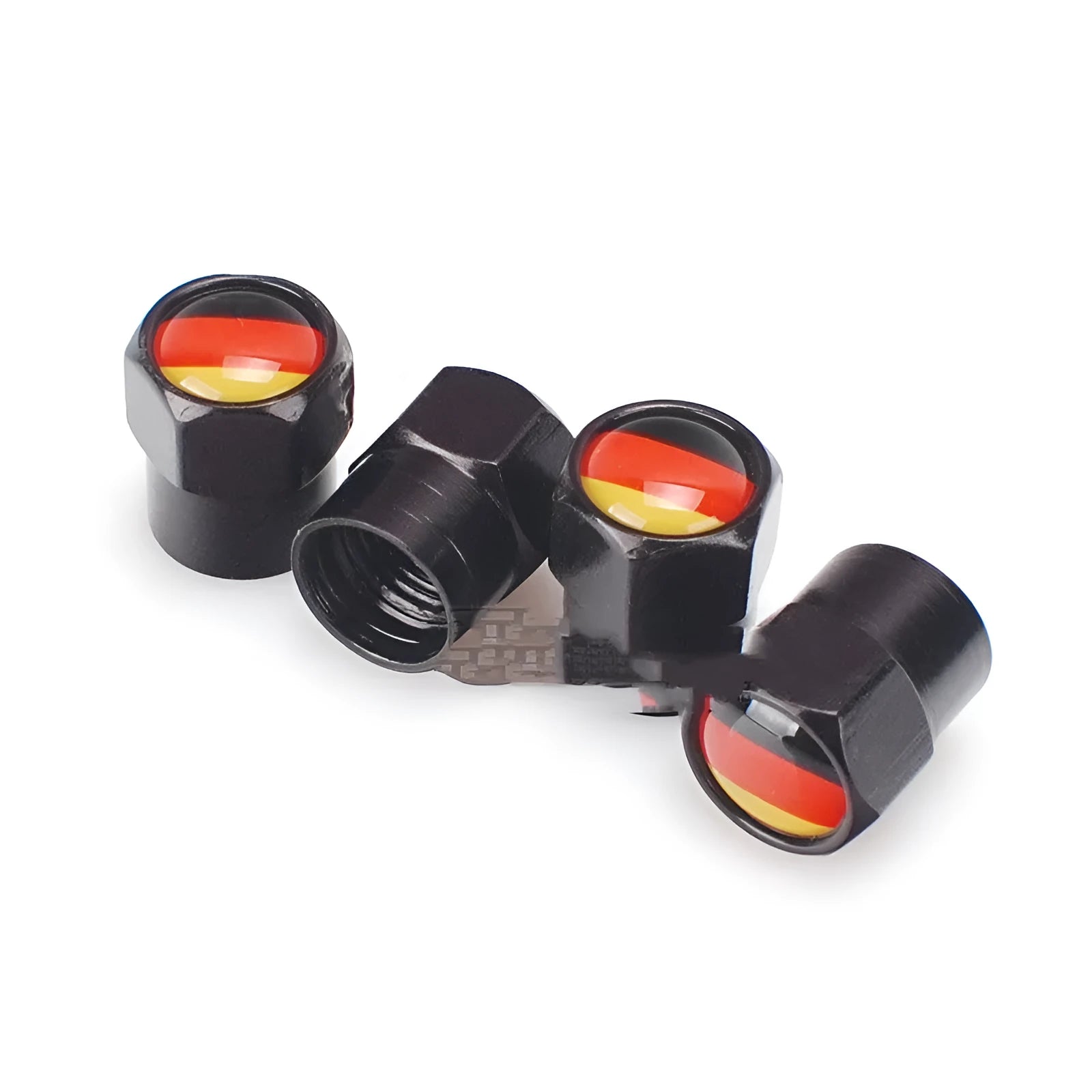 Set of four black metal aluminium alloy valve caps with German flag design on white background