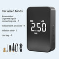 Black wireless digital display car tyre inflator pump with hose and nozzles on a grey background.