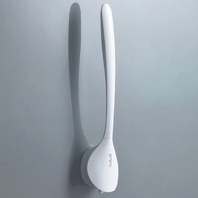 Silicone bathroom cleaning brush with ergonomic curved handle and soft rubber head in black