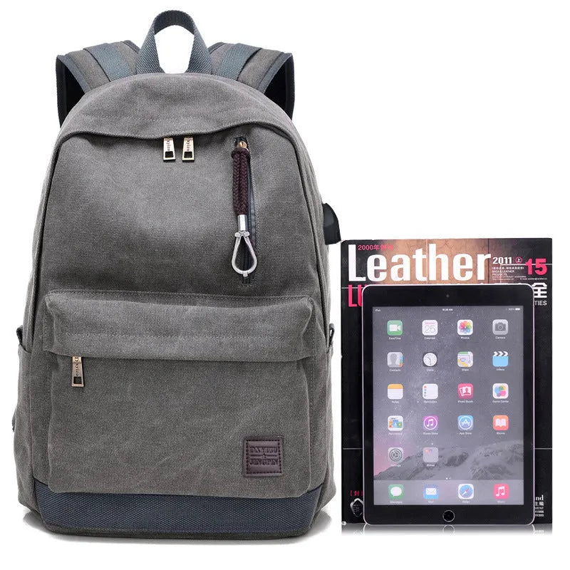 Canvas backpack with USB charging port and multiple pockets including a laptop compartment